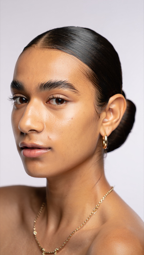 Real clean girl aesthetic result - dewy skin, minimal makeup and slicked-back hair on the same real face